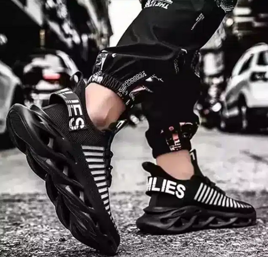 Black sports shoes for men with unique sole design and striped upper fabric for athletic use