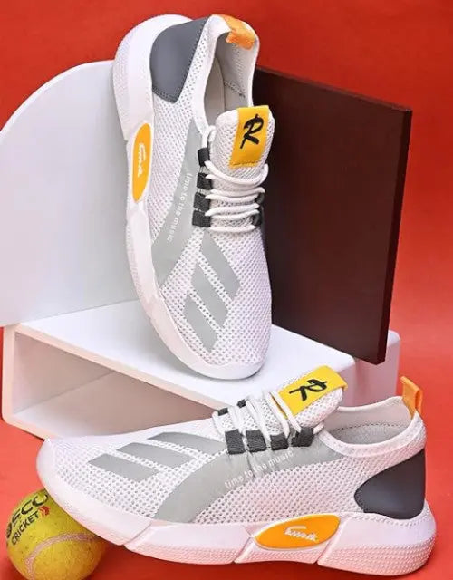 QuickGadgets sports sneakers for men in white and gray with yellow accents and breathable mesh design