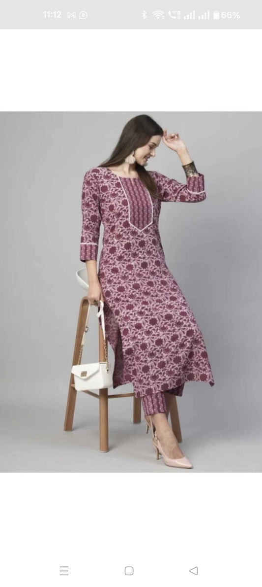 Women wearing maroon floral cotton kurta and pant combo online with matching printed pants and heels