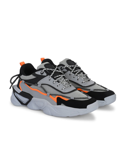 Grey sports shoes for men with black and orange accents and thick sole for outdoor activities