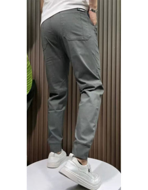 Back view of men's solid joggers pack in gray paired with white school shoes by Dropdash