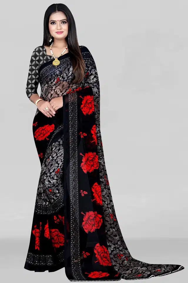 Woman wearing a premium quality saree for women in black with red floral design and intricate patterns
