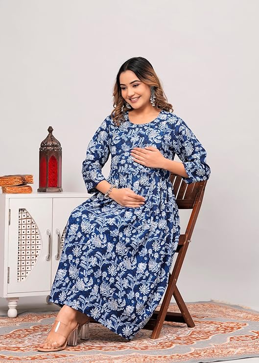 Smiling woman wearing premium quality women kurti India in blue floral print sitting on wooden chair