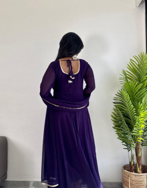 Girl wearing a purple affordable party wear kurti India by Dropdash with long sleeves and back tie detail