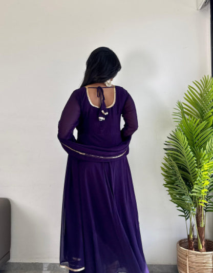 Girl wearing a purple affordable party wear kurti India by Dropdash with long sleeves and back tie detail