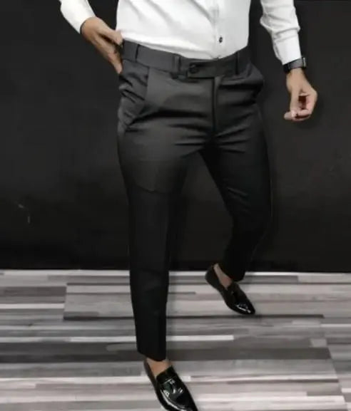 Black lycra formal pants for men paired with white shirt and black loafers by QuickGadgets