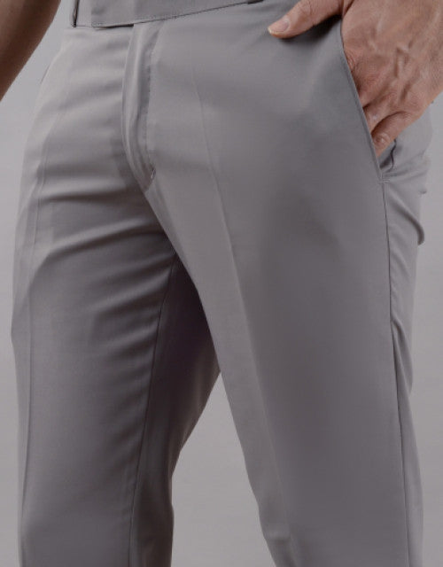 Close-up of light purple men's formal trousers from Dropdash worn with hand in pocket