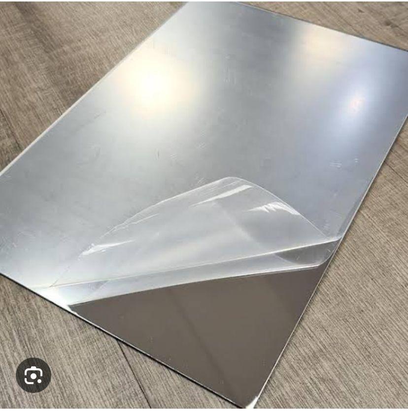 Clear rectangular makeup mirror with protective film on wooden surface buy designer mirrors online India