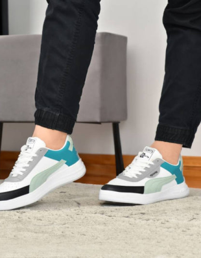 Dropdash casual sneaker shoes for women in white teal and black worn with black pants indoors