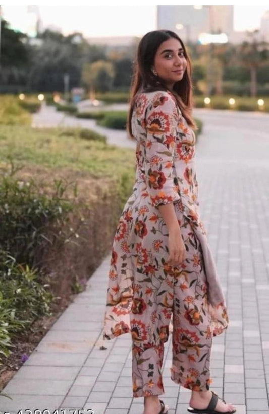 Woman wearing cotton printed kurti with pant featuring floral design in outdoor setting