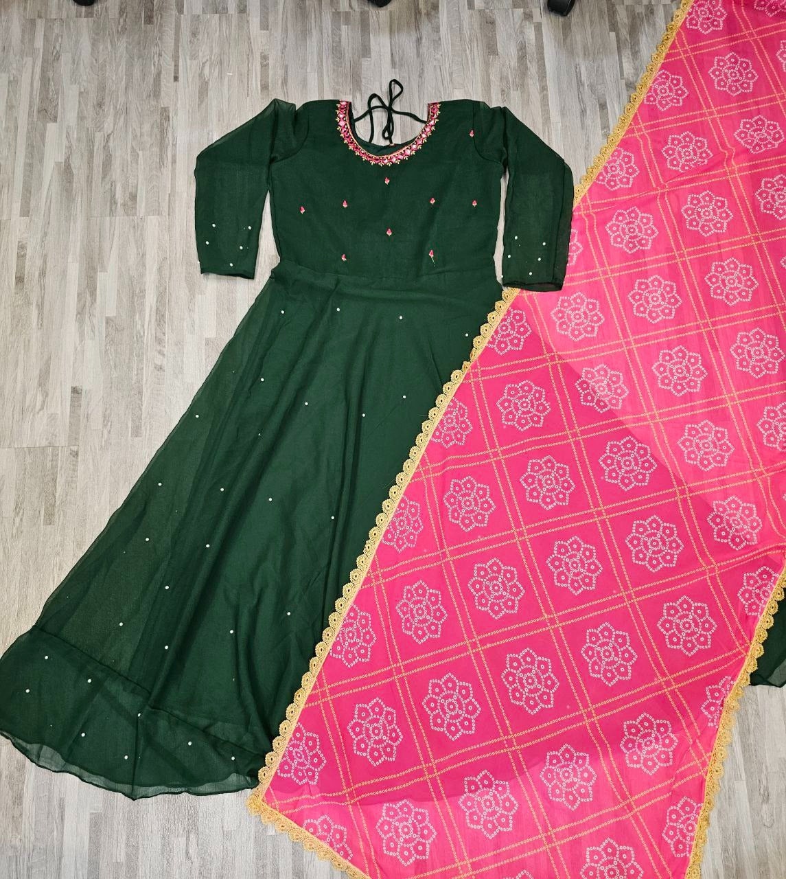 Green women's gown paired with pink dupatta featuring gold border long kurti for wedding and parties