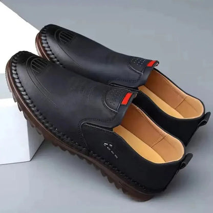 Men's black casual shoes with stitched detailing and cushioned tan interior for everyday comfort