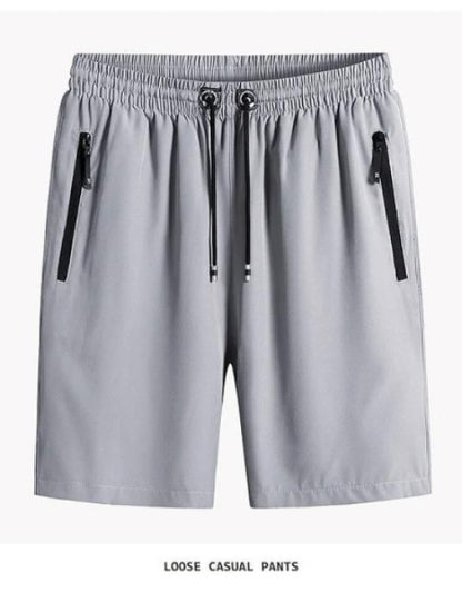 Gray men's cotton polyester shorts with elastic waistband and black zipper pockets