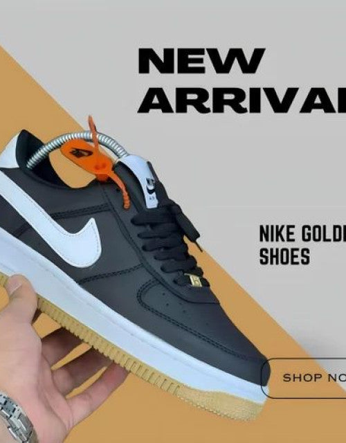 Nike Gold Black Shoe held in hand representing affordable men's casual footwear India collection