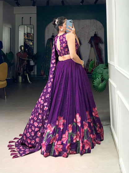 Woman wearing premium quality designer lehenga in purple with floral patterns and sleeveless choli