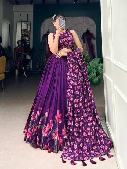 Woman wearing premium quality designer lehenga in purple with floral patterns and matching dupatta
