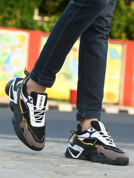Premium quality men's shoes black and gray casual sneakers paired with dark jeans outdoors