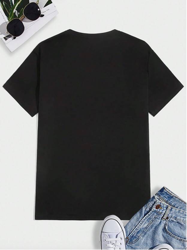 Black printed casual t-shirt for men laid flat with sunglasses, denim shorts, and white sneakers