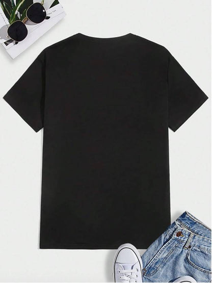 Black printed casual t-shirt for men laid flat with sunglasses, denim shorts, and white sneakers