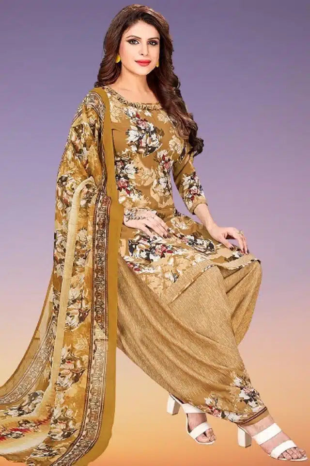 Women wearing mustard printed unstitched dress material for women with floral patterns and matching dupatta