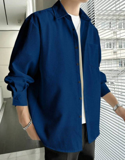 Dropdash TrackPants styled with navy textured overshirt, white tee, and black athletic pants