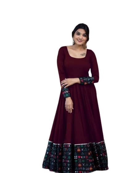 Woman wearing a maroon women's rayon full sleeve gown with patterned cuffs and hem